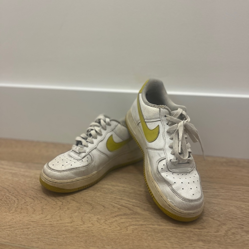 Nike Air Force White Sneakers with Yellow Swoosh